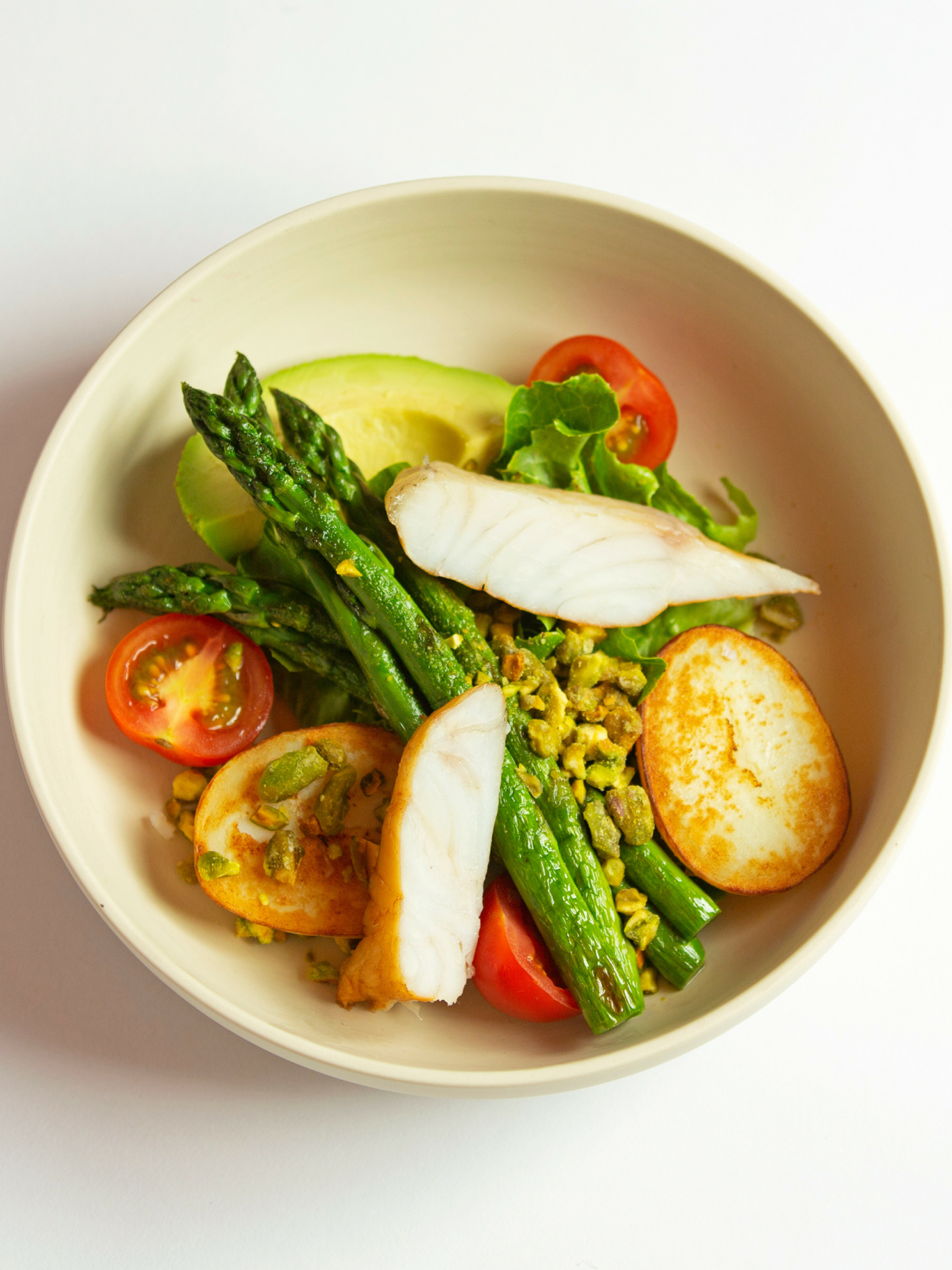 Smoked Aquna Murray cod, avocado, asparagus and pistachio salad